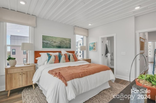 bedroom featuring dark hardwood / wood-style flooring