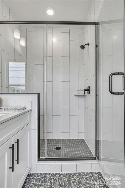 bathroom with vanity, tile patterned floors, and an enclosed shower