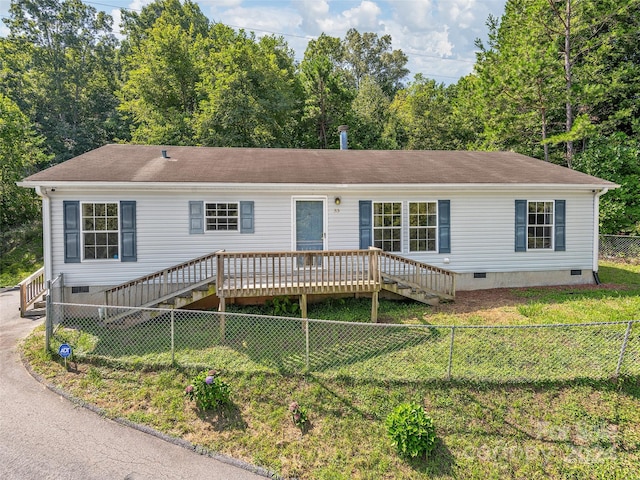 manufactured / mobile home with crawl space, stairway, and a front lawn