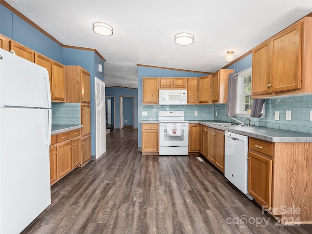 kitchen featuring crown molding, a sink, light countertops, white appliances, and lofted ceiling