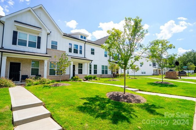 view of front of home with a front yard