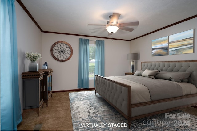 bedroom featuring ceiling fan, crown molding, and carpet floors