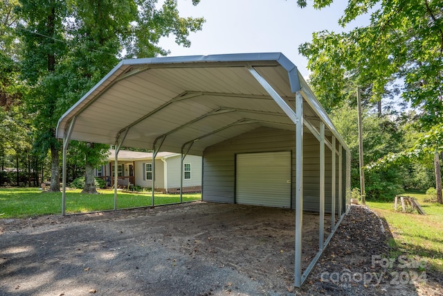 view of parking / parking lot with a garage, a yard, and a carport