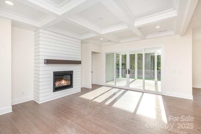 unfurnished living room featuring coffered ceiling, a large fireplace, beam ceiling, and hardwood / wood-style floors