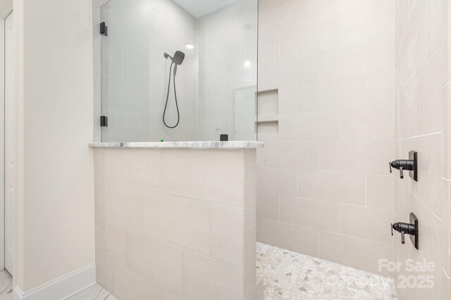 bathroom featuring a walk in shower