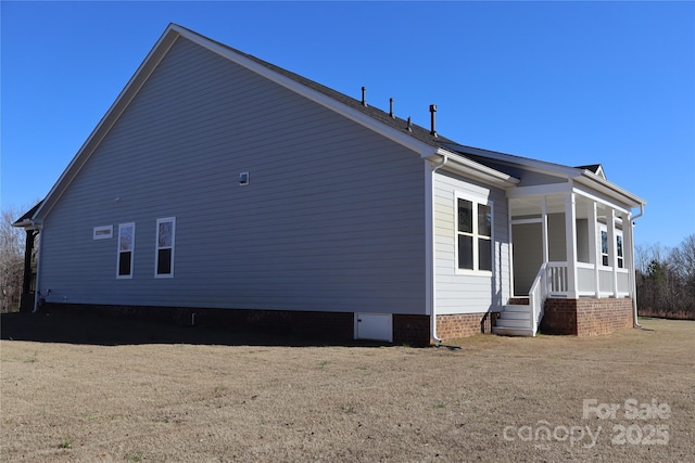 view of property exterior with covered porch