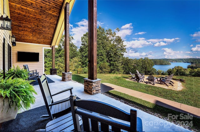 6521 Lake James Rd, Marion, NC 28752 - view of patio with an outdoor fire pit and a water view