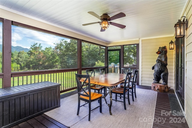 6521 Lake James Rd, Marion, NC 28752 - sunroom featuring ceiling fan, outdoor dining space, and plenty of natural light