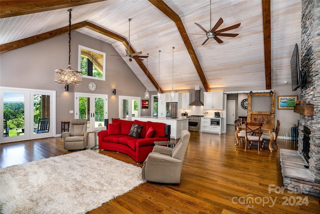 6521 Lake James Rd, Marion, NC 28752 - living room with high vaulted ceiling, french doors, ceiling fan, dark wood-style floors, and a chandelier