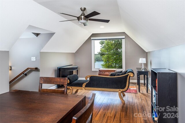 interior space featuring vaulted ceiling, hardwood / wood-style flooring, and ceiling fan