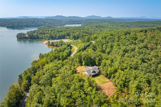 bird's eye view with a water and mountain view