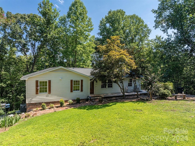 back of house featuring a yard