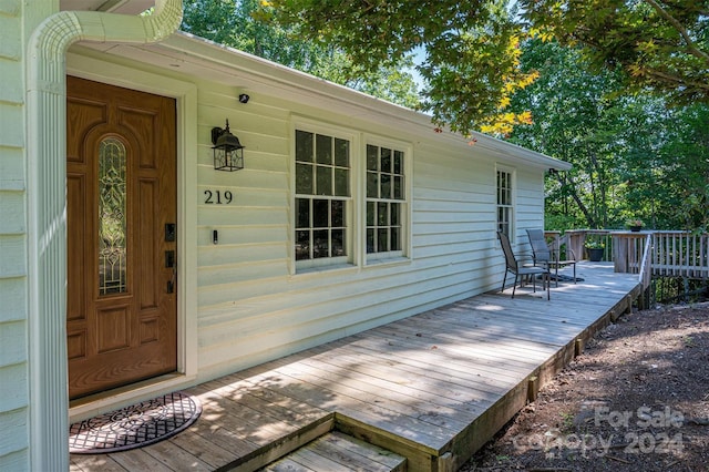 entrance to property with a wooden deck