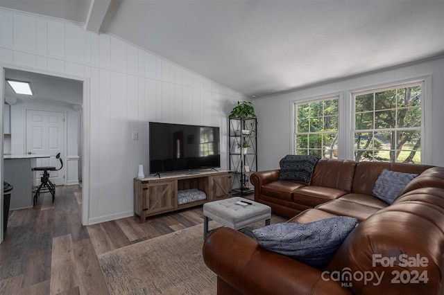 living room featuring lofted ceiling with beams and dark hardwood / wood-style flooring