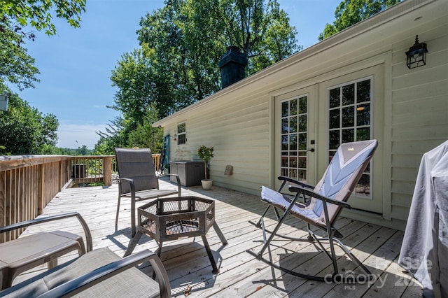 wooden terrace featuring french doors