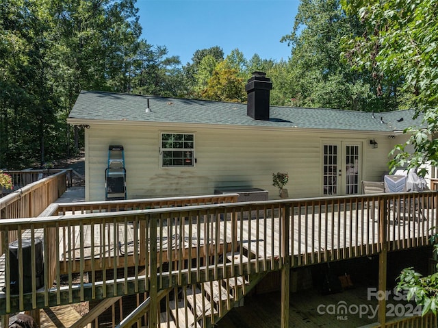 wooden deck with central air condition unit and french doors