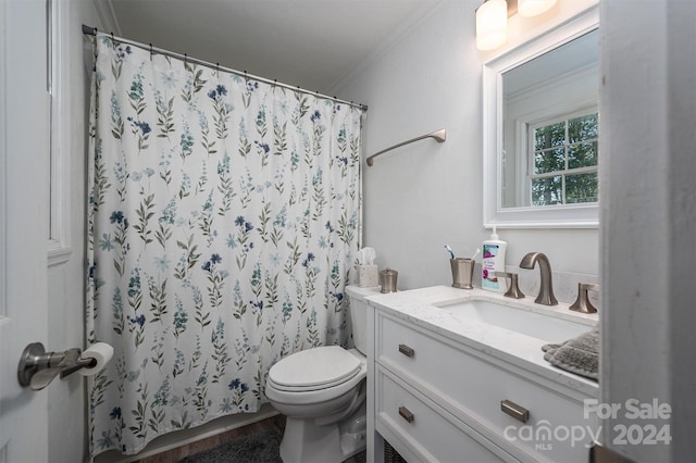 bathroom featuring walk in shower, toilet, vanity, and ornamental molding