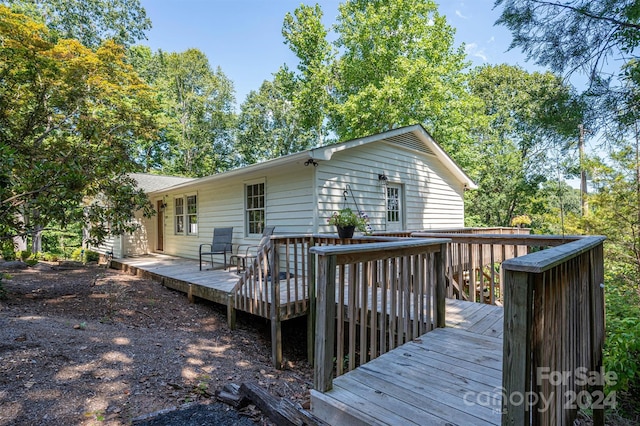 rear view of house with a deck