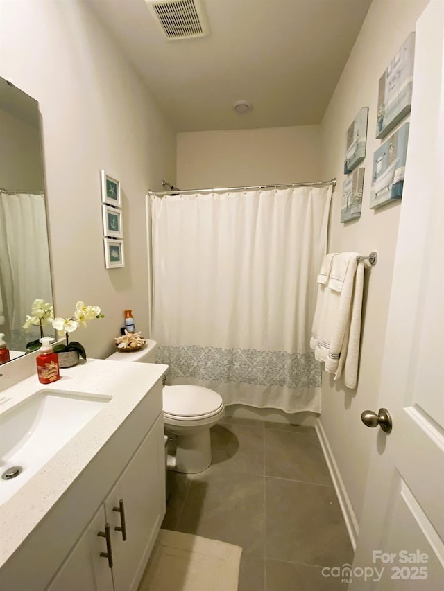 bathroom featuring tile patterned flooring, vanity, a shower with shower curtain, and toilet