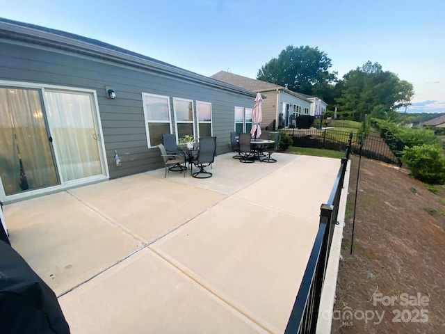 view of patio / terrace featuring fence