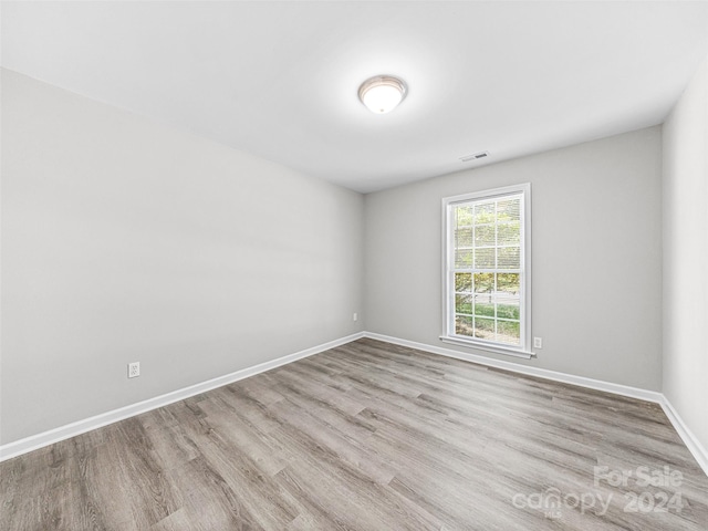 unfurnished room featuring light wood-type flooring