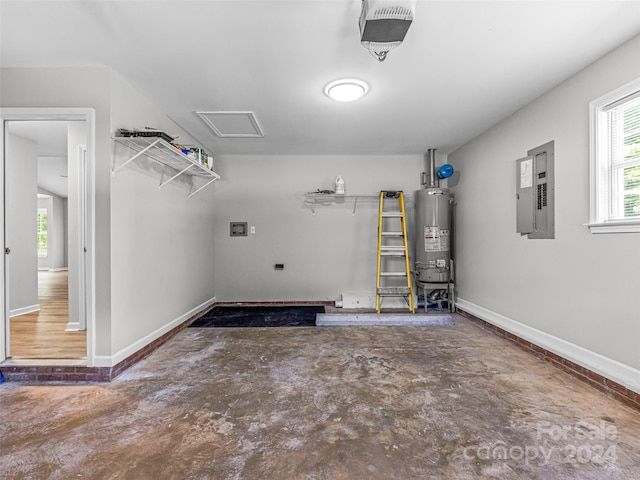 garage featuring gas water heater and electric panel