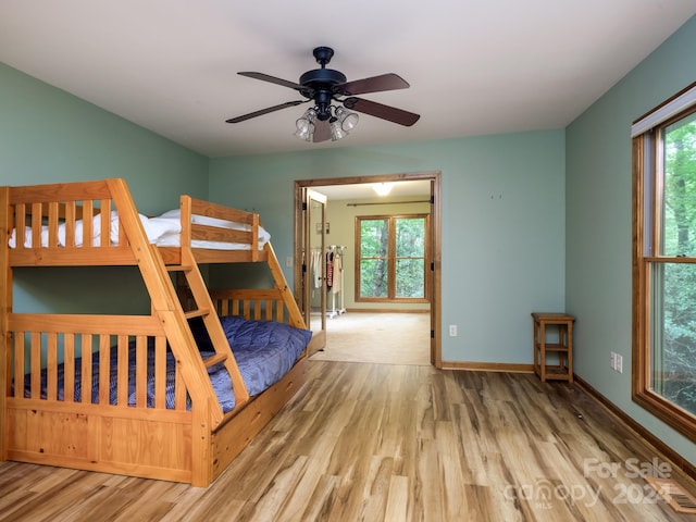 unfurnished bedroom with light hardwood / wood-style flooring and ceiling fan