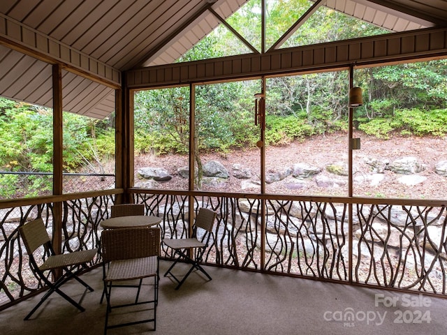 2921 Connestee Trl, Brevard, NC 28712 - unfurnished sunroom featuring lofted ceiling and outdoor dining space