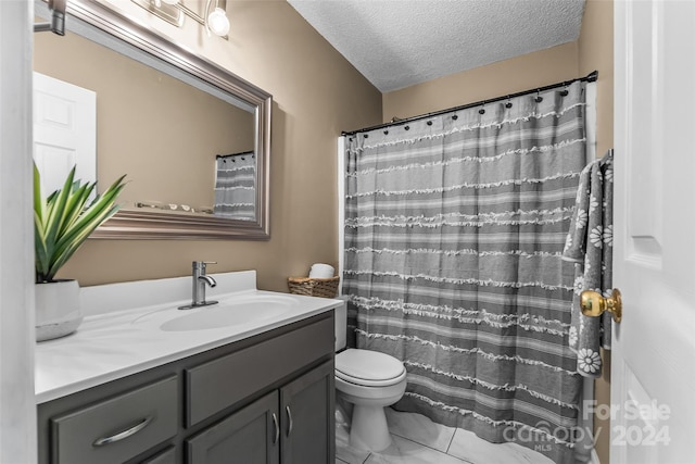 full bath featuring curtained shower, toilet, a textured ceiling, and vanity