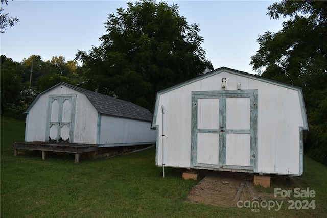 view of outdoor structure with a lawn