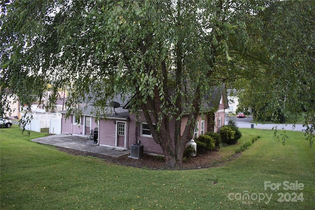 exterior space featuring central AC unit and a patio