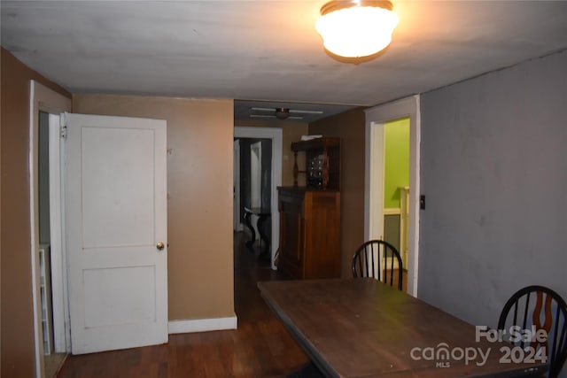 unfurnished dining area featuring dark hardwood / wood-style flooring