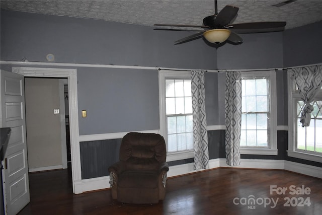 unfurnished room with a textured ceiling, ceiling fan, and hardwood / wood-style floors