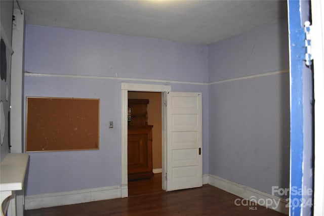 spare room with hardwood / wood-style floors