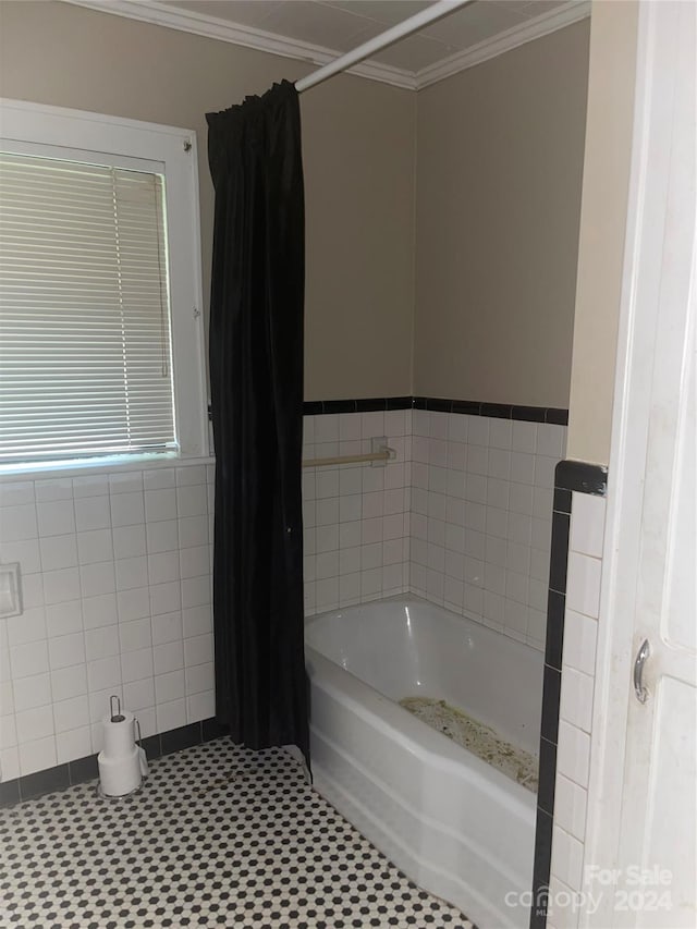 bathroom featuring tile walls, ornamental molding, and tile patterned flooring