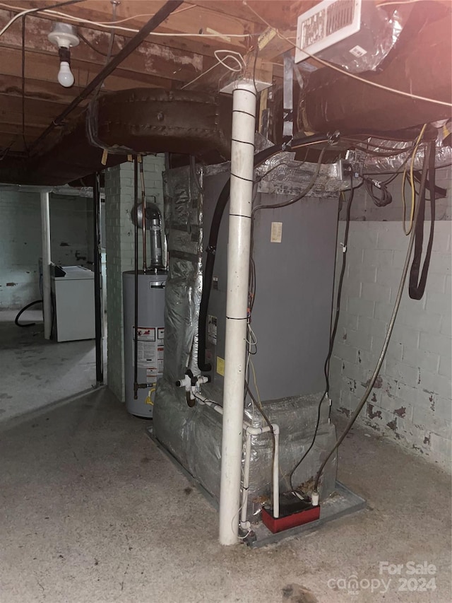 basement featuring washer / dryer and water heater