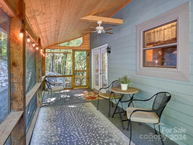 sunroom / solarium with french doors, ceiling fan, wooden ceiling, and vaulted ceiling