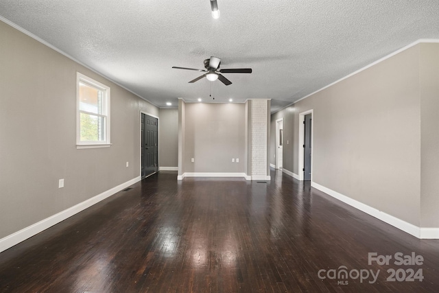 unfurnished room featuring hardwood / wood-style flooring, ceiling fan, a textured ceiling, and ornamental molding