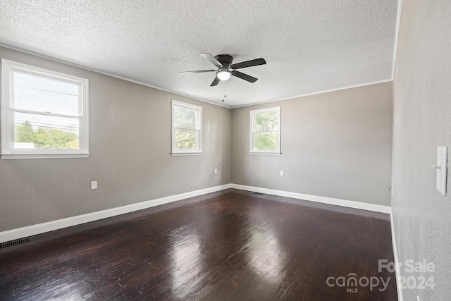 spare room with a textured ceiling, ceiling fan, crown molding, and wood-type flooring