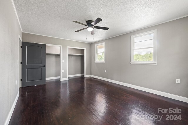 unfurnished bedroom featuring ceiling fan, wood-type flooring, and a textured ceiling