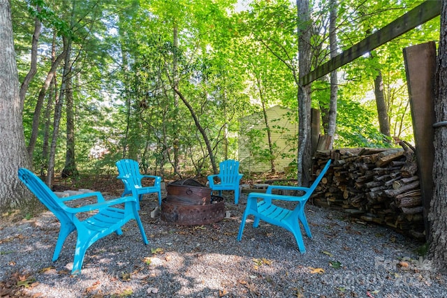 view of yard featuring an outdoor fire pit