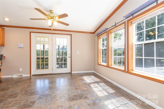 spare room featuring lofted ceiling, ceiling fan, and ornamental molding