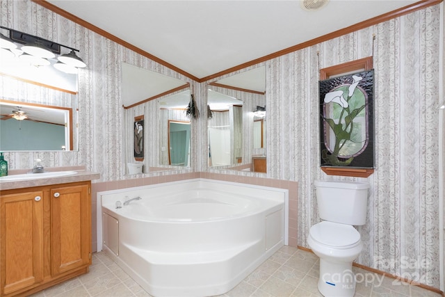 bathroom with vanity, toilet, a bathing tub, and tile patterned floors