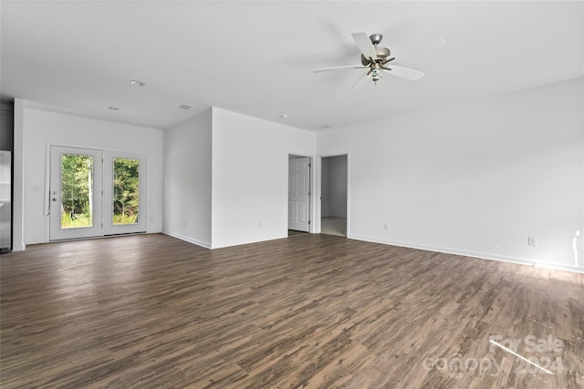 empty room with ceiling fan and dark hardwood / wood-style floors