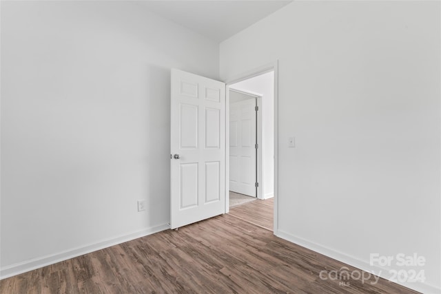 spare room with hardwood / wood-style floors