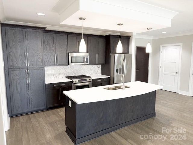 kitchen featuring a kitchen island with sink, stainless steel appliances, sink, and light hardwood / wood-style floors