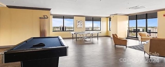 recreation room featuring a wall of windows, billiards, and wood-type flooring