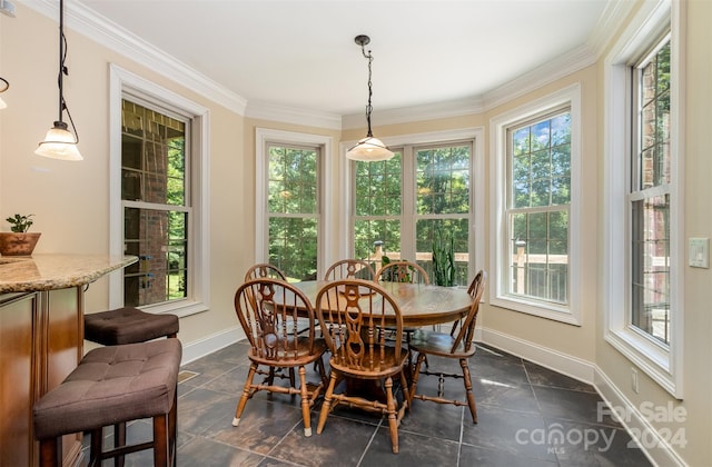 tiled dining space featuring ornamental molding