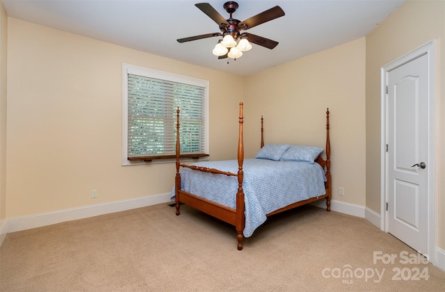 bedroom featuring ceiling fan and light colored carpet