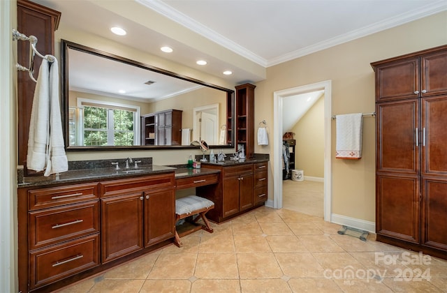 bathroom featuring tile patterned flooring, crown molding, and vanity